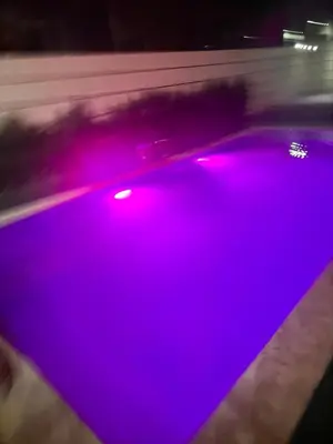 a purple light on the back of a car at Riad El Menzeh in Meknès