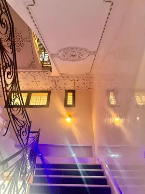 a staircase in a building with purple lights at Riad El Menzeh in Meknès