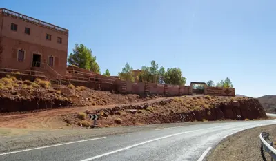 a road with a train on top of a hill at Auberge Mounia in Telouet