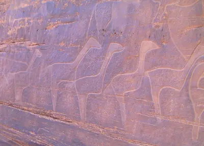a painting of animals on the side of a rock at Maison Ich chez Abdel in Ich