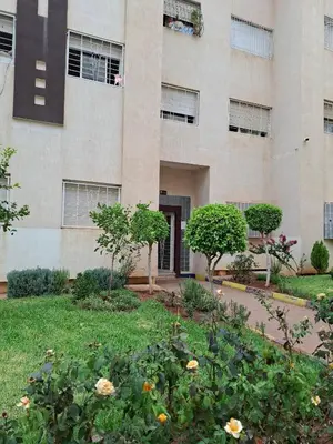 a building with a garden in front of it at Appartement à côté de Kitea route de Sefrou in Fès