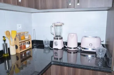 a kitchen counter with a blender on a counter top at Miramar Prestigia in Ville Nouvelle