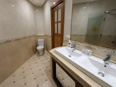 a bathroom with a sink and a toilet at Appartement a Meknès-Hamria in Meknès