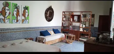 a living room with two beds and a couch at زاوية السعادة in Fès