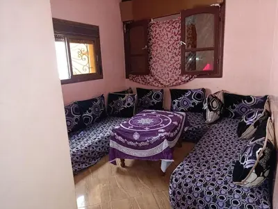 a living room with a couch and a table at Tradionelle Berber Ain Sardoun in Beni Mellal