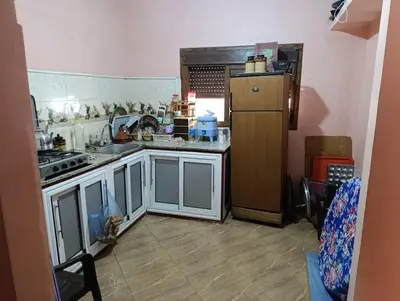 a kitchen with a stove and a refrigerator at Tradionelle Berber Ain Sardoun in Beni Mellal