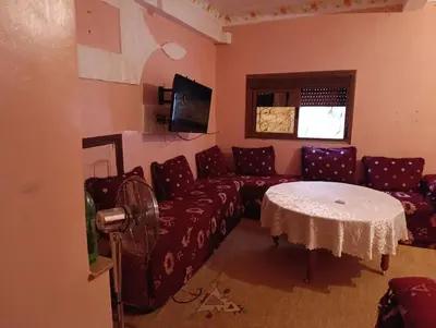 a living room with a couch and a table at Tradionelle Berber Ain Sardoun in Beni Mellal