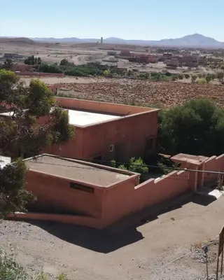 a view of a building in the desert at Dâr Mâbâ in Tazenakht