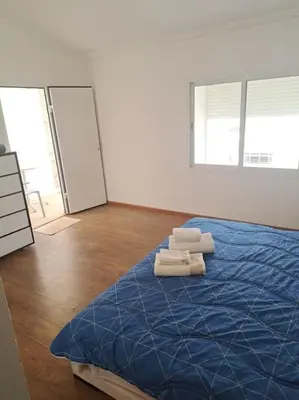 a room with a bed with towels on it at Chalet Villa de Luxe - Piscine in Dchar Aït Belkassem