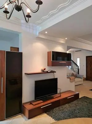 a living room with a flat screen tv at Chalet Villa de Luxe - Piscine in Dchar Aït Belkassem