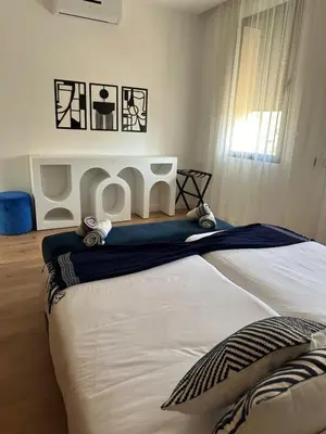 a bedroom with a large bed in a room at Villa de standing piscine à débordement à 15 min de Marrakech in Ourika