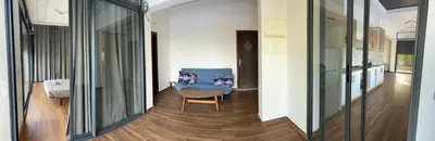 a hallway with a blue chair in a house at Domaine Farah in Meknès