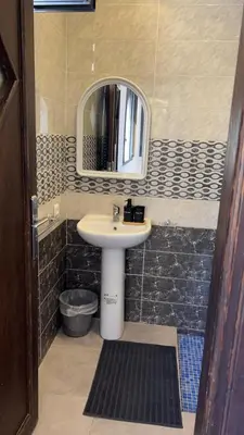a bathroom with a sink and a mirror at Domaine Farah in Meknès