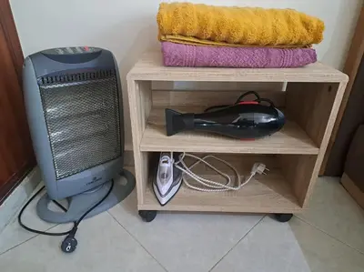 a desk with a computer monitor on a shelf at Appartement Centre Ville - ATLAS 46 in Fès