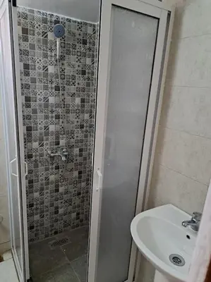 a bathroom with a shower and a sink at Appartement Atlas City Center 2 in Fès