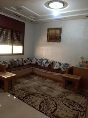 a living room with a couch and a rug at Tifelt in Tiflet
