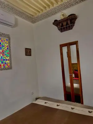 a room with a room with a door and a window at Appartement khmissa in Fès al Bali