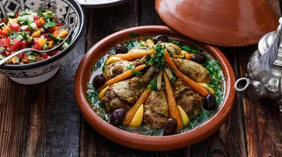 a bowl of food with vegetables and a bowl of salad at Aaladdin luxury camp in Merzouga