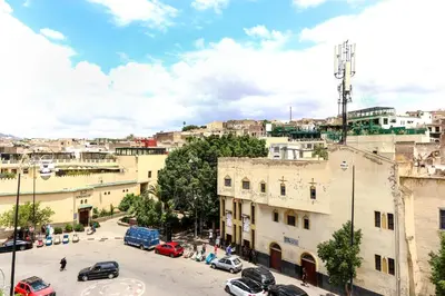 a view of a city with cars parked on a street at Dar Ibn Majdoub Lala aicha & Alia in Fès