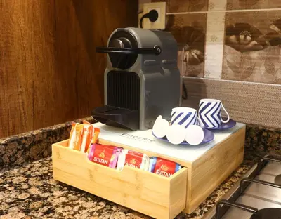 a coffee machine sitting on top of a counter at Dar Ibn Majdoub Prive Entier in Fès