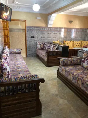 a living room with couches and couches at Mahmoud moulay Yacoub 1 in Moulay Yacoub