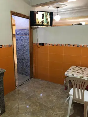 a room with a table and a shower in a room at Mahmoud moulay Yacoub 1 in Moulay Yacoub