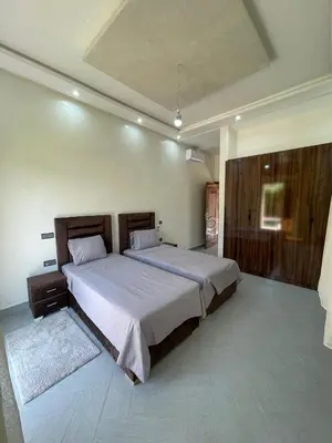 a bedroom with a large bed in a room at Villas Près De Chez Vous in Amezrou