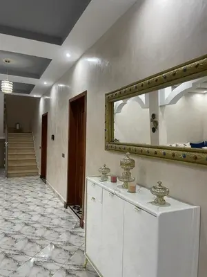 a mirror on the wall of a room with a counter at Villas Près De Chez Vous in Amezrou