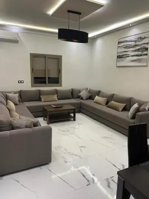 a living room with a couch and a table at Appartement la Cañada in Ville Nouvelle
