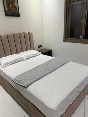 a large bed in a bedroom with a window at Appartement la Cañada in Ville Nouvelle