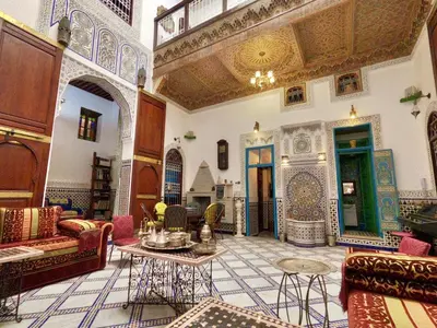 a large living room with furniture and a ceiling at Riad d'Art de Fès in Fès al Bali