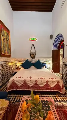a bedroom with a bed in a room at Riad d'Art de Fès in Fès al Bali