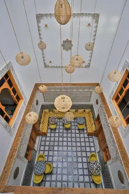 an overhead view of a tile floor with yellow shoes at Dar Golden Ziat in Fès