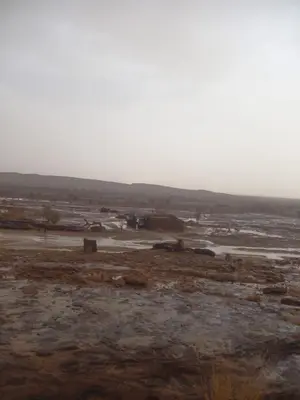 a view of a muddy field with a river at Segaoui House in Merzane