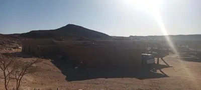 a view of a desert with a mountain in the background at Segaoui House in Merzane
