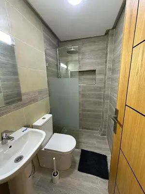 a bathroom with a toilet and a sink and a shower at appartement à fes in Fès