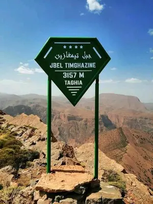 a sign on the top of a mountain at Taghia Accommodation in Taghia