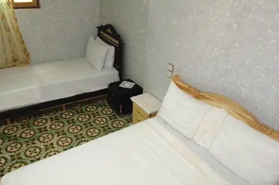 a bedroom with two beds in a room with at Appartement lala Houriya fez in Fès