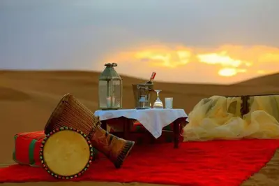 a table in the middle of the desert at Luxury Camp Glamping in Merzouga