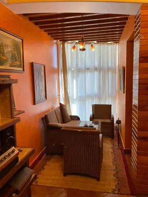 a living room with a couch and a table at Nice appartement au centre de IFRANE in Ifrane