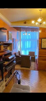 a living room with a couch and a piano at Nice appartement au centre de IFRANE in Ifrane