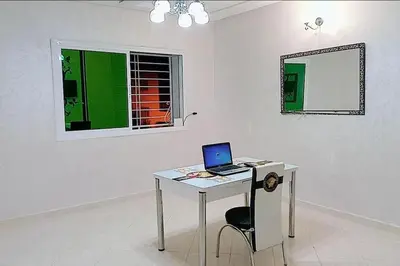a laptop computer sitting on a desk in a room at شقة بموقع جد مناسب فاس in Fès