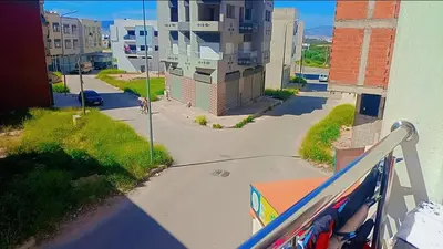 a view of a street from a balcony of a building at شقة بموقع جد مناسب فاس in Fès