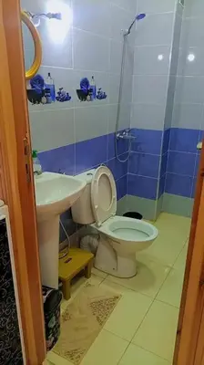 a bathroom with a toilet and a sink at شقة بموقع جد مناسب فاس in Fès
