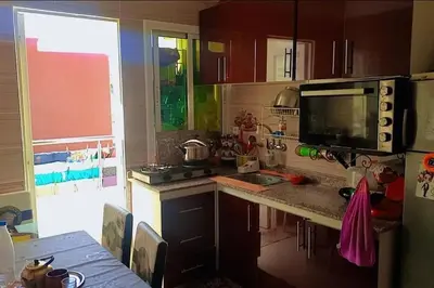 a kitchen with a sink and a counter top at شقة بموقع جد مناسب فاس in Fès