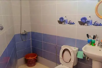 a bathroom with a toilet and a sink at شقة بموقع جد مناسب فاس in Fès