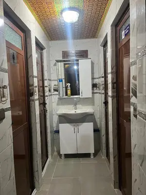 a bathroom with a sink and a mirror at Villa Maroua in Madkhal Meski