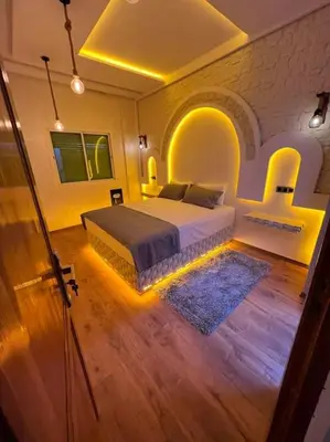 a bedroom with a large bed in a room at Appartement fes sami haut standing in Fès