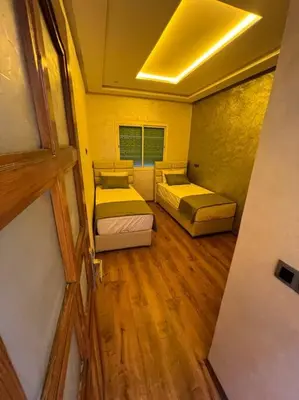 an overhead view of a bedroom with two beds at Appartement fes sami haut standing in Fès