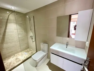 a bathroom with a toilet and a shower and a sink at Appartement luxueux Prestigia Wifi Fibre Optique in Fès